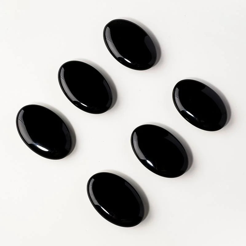 Dark obsidian decorative stone shown as a compact shelf and desk accent
