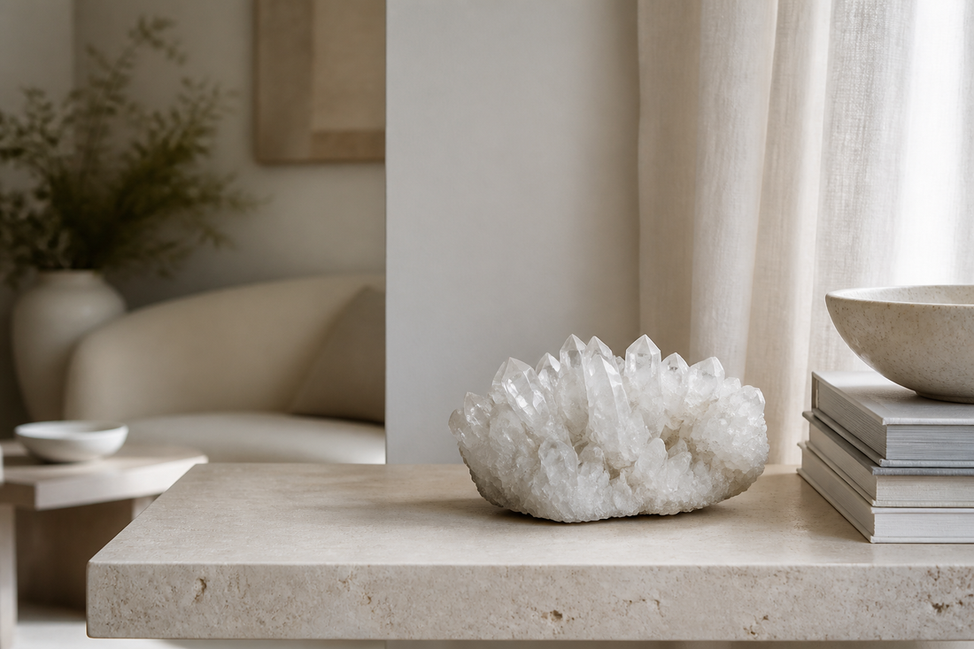 Editorial home scene with a white crystal cluster on a warm neutral console table